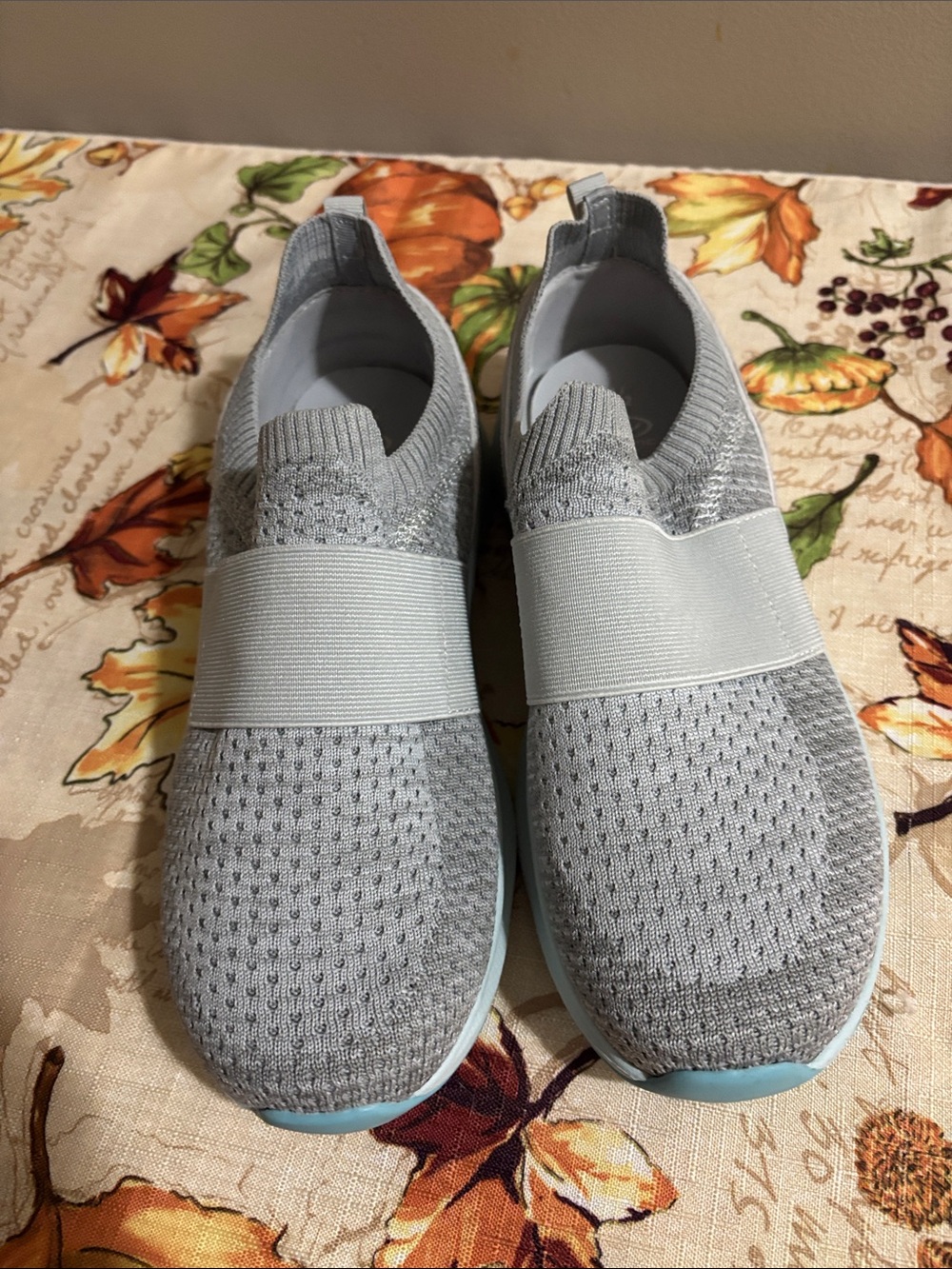 Light Gray Slip-On Sneakers with Pale Blue Soles
